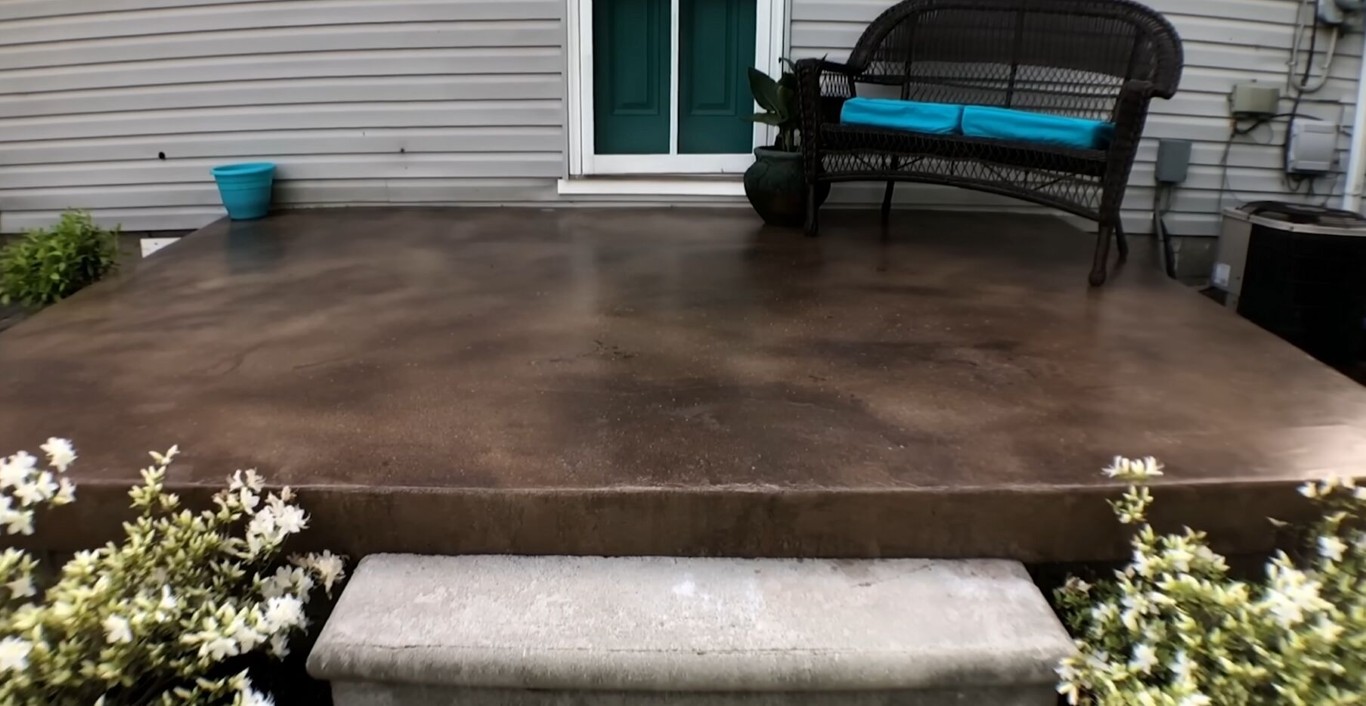 Custom concrete patio installation in Atascocita backyard
